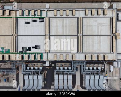 Data center building roof with cooling units and industrial infrastructure. Global it technology and cloud computing network concept Stock Photo