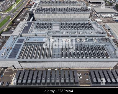 Large data center complex showing modular server units, cooling systems, and solar panels for cloud technology and digital services Stock Photo