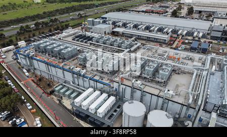 Large data center facility with multiple cooling units located by a highway Stock Photo