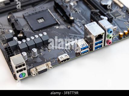 A closeup shot details the intricate components of a computer motherboard Stock Photo
