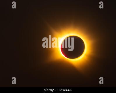 Total solar eclipse with corona and red prominence Stock Photo