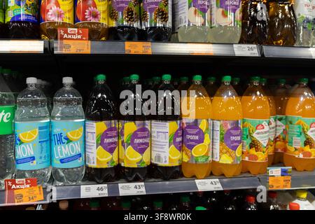 Horodok, Ukraine - March 23, 2026: Diverse carbonated fruit juice drinks displayed in a store aisle, representing consumer choice and market availabil Stock Photo
