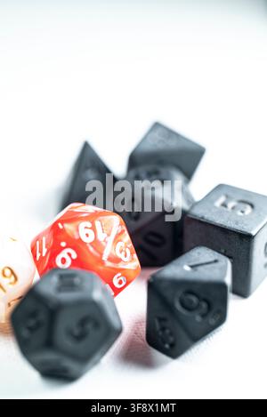 Tabletop gaming accessories featuring multi sided dice for fantasy board games isolated on white Stock Photo