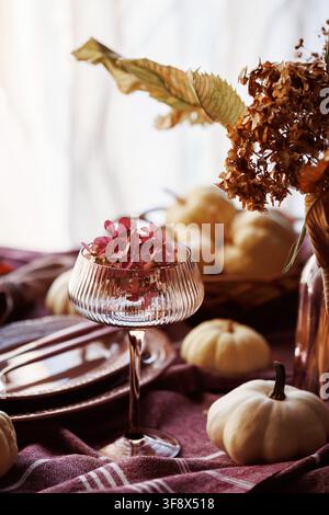 Elegant autumn table setting with pumpkins and dried flowers Stock Photo