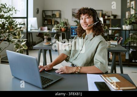 Portrait of Biracial Woman Working in Customer Support Call Center Stock Photo