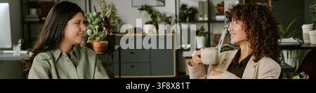 Header of Diverse Women Talking during Coffee Break in Modern Office Stock Photo