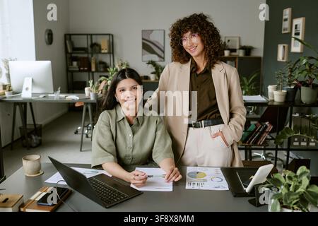 Portrait of Diverse Women Working Together in Modern Office Stock Photo