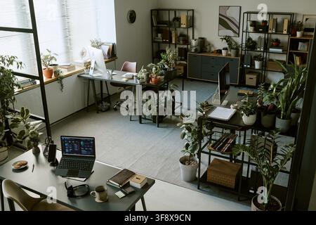 Empty Modern Office with Green Plants and Computers Stock Photo