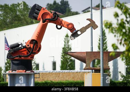 Industrial robot sculpture symbolizing automation and the use of robotics for heavy-duty work. Stock Photo