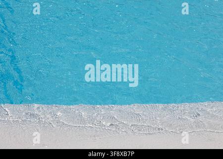 Blue water and ripples creating a clean, fresh surface background in a swimming pool Stock Photo