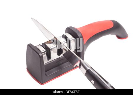 Manual new knife sharpener and knife isolated on white. Stock Photo