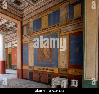 Aaschaffenburg, Germany - 18 Jul 25: Wide view of a Roman-style gallery with frescoed walls, mosaic floor, and sculptural displays inside the Pompejan Stock Photo