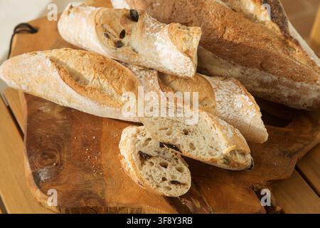 serving bread for Breakfast, sliced baguette with olives Stock Photo