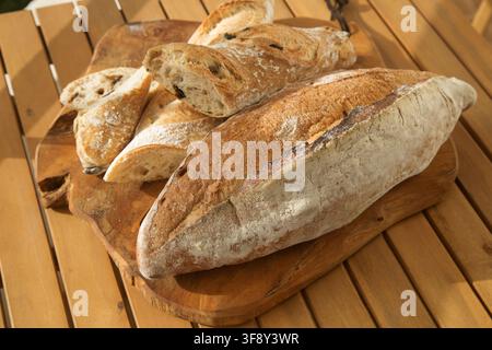 serving bread for Breakfast, sliced baguette with olives Stock Photo