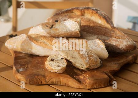 serving bread for Breakfast, sliced baguette with olives Stock Photo