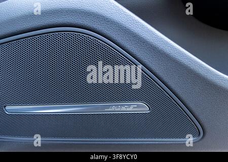 Vinkovci, Croatia - May 15.2026:Close-up view of a Bose speaker grille integrated into a car door panel, highlighting premium audio, textured material Stock Photo