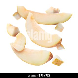 Pieces of melon flying in air on white background Stock Photo
