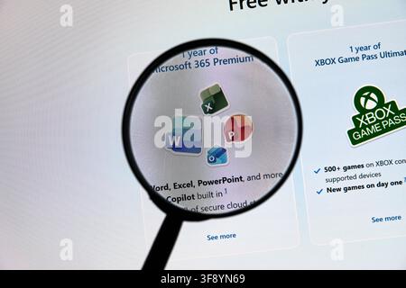 CARROLLTON, TX, USA - AUGUST 01, 2026: A magnifying glass focuses on Microsoft 365 Premium features displayed on a computer screen. Visible applicatio Stock Photo