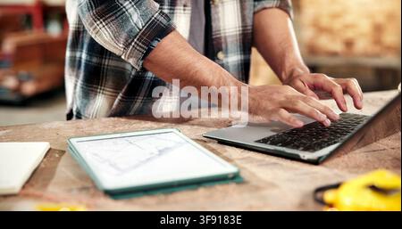 Planning, hands and typing on laptop for carpentry, cut list update and log client revision on app. Carpenter, person and tech screen in workshop for Stock Photo