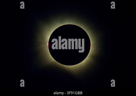 Total solar eclipse showing the glowing solar corona and red solar prominences, observed from Vega del Codorno, Cuenca, Spain on August 12, 2026. Stock Photo