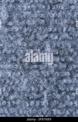 Vertical close up grey loop pile carpet texture, showing soft woven wool background for interior art Stock Photo