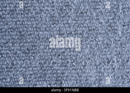 Seamless grey loop pile carpet texture background, offering soft woven fabric surface macro view Stock Photo
