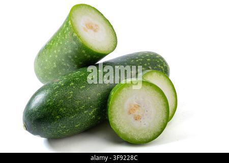 Whole and Sliced Small Green Wax Gourd Isolated on White Stock Photo