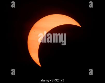 Jacobsdorf, Germany. 12th Aug, 2026. A partial solar eclipse (photographed with a special protective filter attached to the camera). On August 12, 2026, the Sun was the focus of astronomers· attention, as a significant partial solar eclipse occurred that evening. During this rare natural spectacle, the Moon obscured 80 to 90 percent of the Sun·depending on the region·across Germany, transforming it into a narrow crescent. Credit: Patrick Pleul/dpa/Ģ����ý Live News Stock Photo