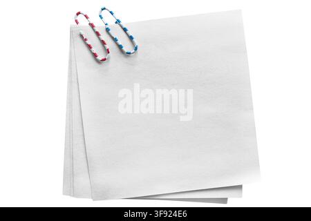 Blank white note paper fastened with a paper clips isolated on white background Stock Photo