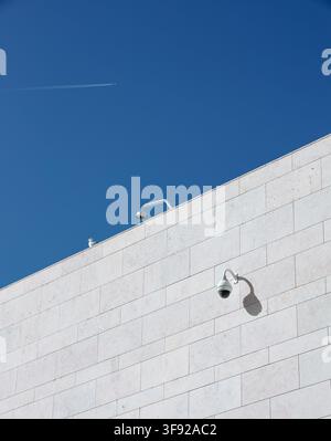 Security cameras and a seagull on a modern building Stock Photo