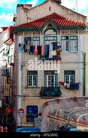 Colorful laundry drying on an old Lisbon apartment building Stock Photo