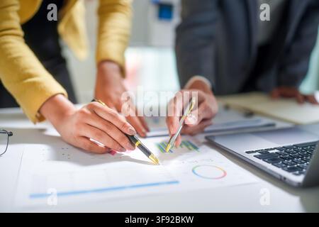 Business Team Analyzing Financial Charts Stock Photo