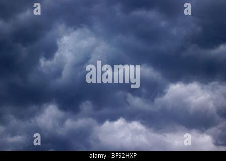 Dark stormy clouds covering the sky before rain Stock Photo