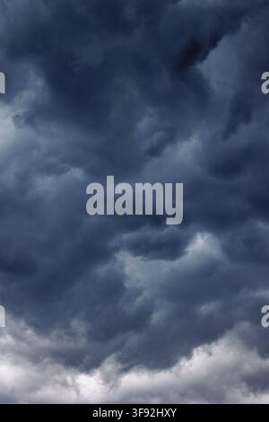 Dark stormy clouds covering the sky before rain Stock Photo