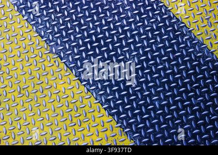 Yellow and blue painted diamond plate metal texture with diagonal stripes background Stock Photo