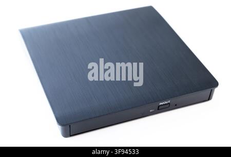 A sleek black external optical drive sits on a white background Stock Photo