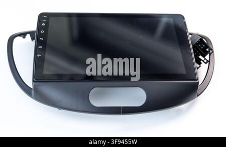 Black car multimedia touchscreen head unit with plastic bezel on white Stock Photo