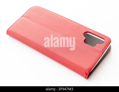 A red textured flip phone case sits on a white background Stock Photo