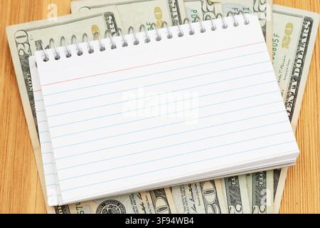 Money with blank index cards on wood desk for budgeting and savings Stock Photo