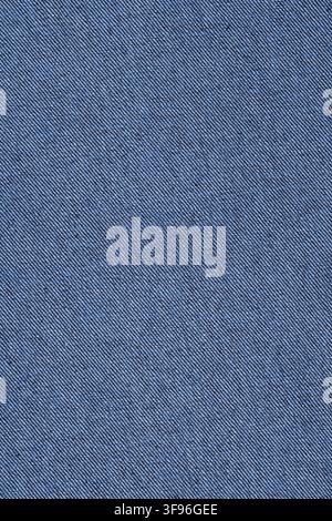 Blue denim fabric texture for background or clothing design. Close up of woven jeans cotton material. Durable blue textile surface for fashion apparel Stock Photo