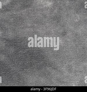 Dark grey jeans denim texture background. Worn cotton fabric material surface with detailed weave pattern. Industrial textile design element for cloth Stock Photo