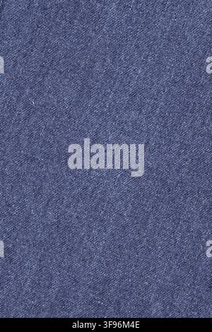 Blue denim fabric texture background. Close up view of rough cotton jeans textile material. Surface pattern of casual clothing apparel for design wall Stock Photo