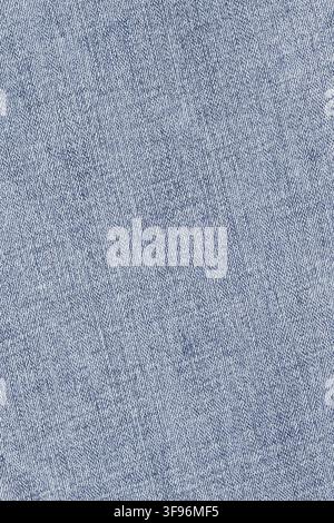 Blue denim fabric texture close up view. Detailed cotton textile pattern background. Casual clothing material for fashion design and apparel industry Stock Photo