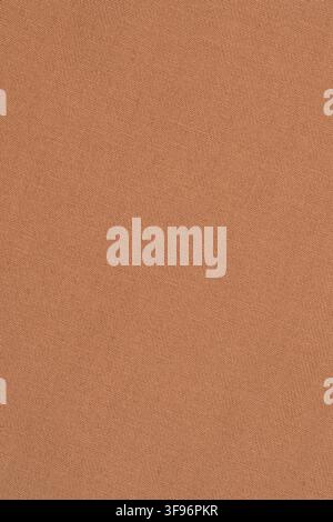 Brown denim fabric texture background. Close up of woven cotton textile with herringbone pattern. Durable material for clothing production and fashion Stock Photo