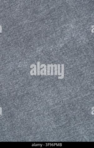 Grey denim fabric texture close up. Woven cotton material pattern with detailed stitch. Jeans clothing background for fashion design project and texti Stock Photo