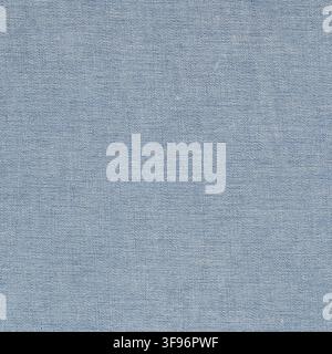 Blue denim fabric texture close up. Woven cotton material background for fashion design. Durable textile surface for creative clothes manufacturing or Stock Photo
