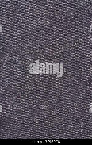 Dark blue denim fabric texture. Material background for fashion design. Textile detail with canvas surface and woven pattern. Strong cotton cloth patt Stock Photo