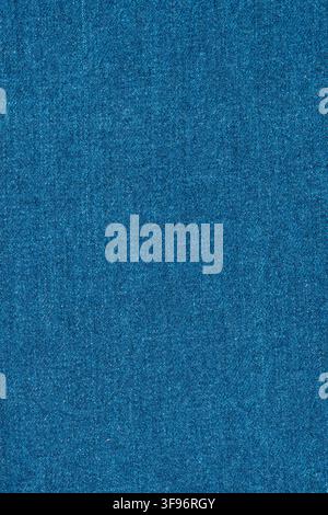 Blue denim fabric texture surface. Close up of woven jeans material. Natural cotton cloth background for fashion design, textile pattern, garment indu Stock Photo