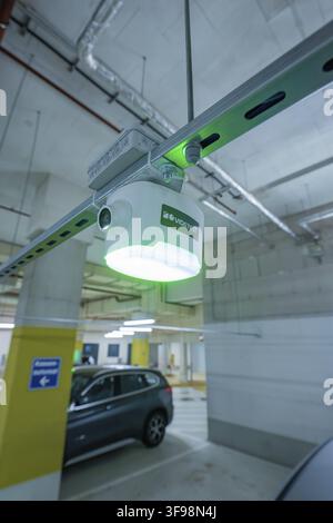 Security camera mounted on a concrete ceiling in a parking garage, Milaneo, Stuttgart, Germany Stock Photo