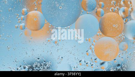Abstract image of blue and orange bubbles floating in water Stock Photo